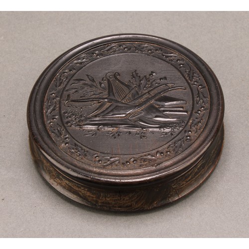 1417 - A 19th century pressed horn waisted circular snuff box, the push-fitting cover with a titled hunting... 