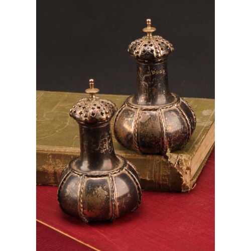 892 - A pair of Victorian Gothic Revival silver peppers, rope-twist borders, 8.5cm high, George Fox, Londo... 