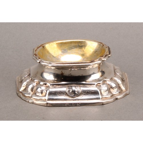 983 - An 18th century German silver trencher salt, the fluted base with portrait roundels, gilt interior, ... 