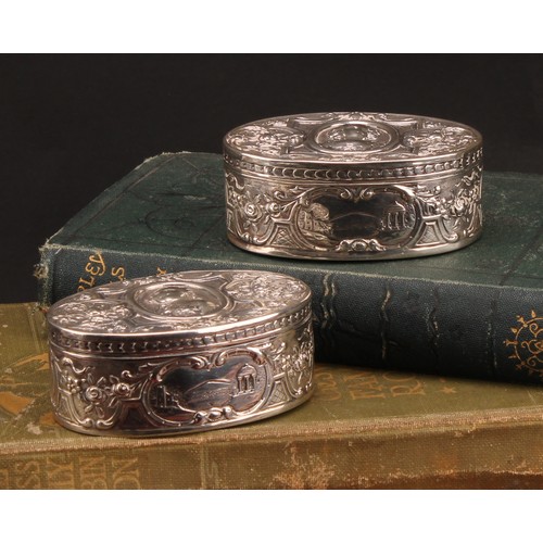 854 - A pair of 19th century German silver oval snuff boxes, hinged covers chased with portraits of Louis ... 