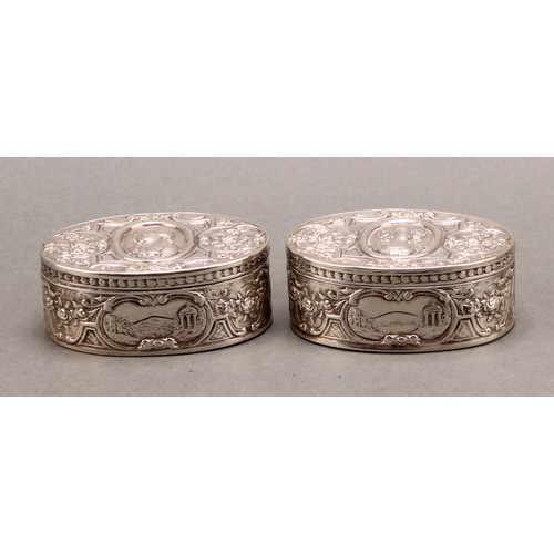 854 - A pair of 19th century German silver oval snuff boxes, hinged covers chased with portraits of Louis ... 