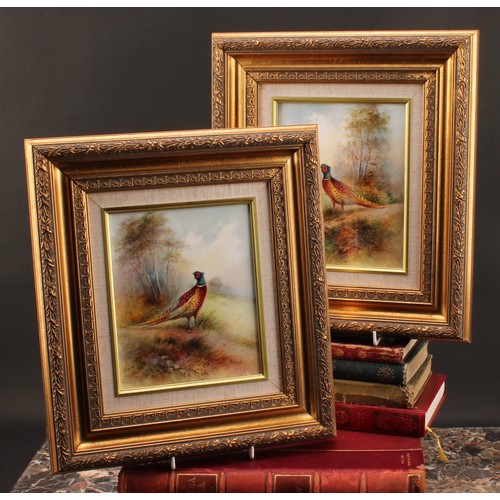 103 - A pair of rectangular porcelain plaques, painted by T. G. Abbotts, signed, with pheasants in woodlan... 