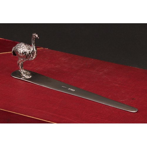 1031 - An Edwardian silver letter knife, mounted with a model of an ostrich, 18cm long, A. Barrett & Sons, ... 