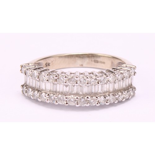 1202 - A diamond cluster ring, pave encrusted with baguette and round brilliant cut diamond arranged in thr... 