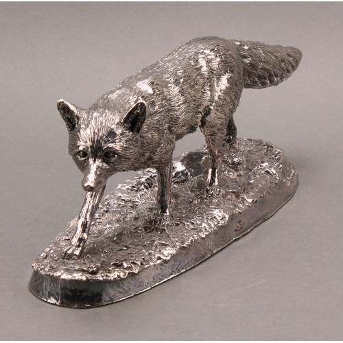 1054 - An Elizabeth II silver model, of a fox, after Robert Donaldson, naturalistically chased, shaped oval... 