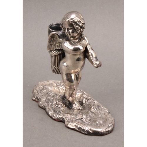 740 - A Cyprian Mandos silver novelty table vesta, modelled as a cherub carrying a quiver, naturalisticall... 