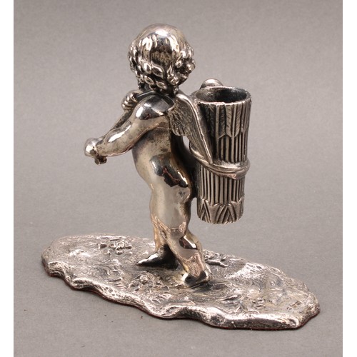 740 - A Cyprian Mandos silver novelty table vesta, modelled as a cherub carrying a quiver, naturalisticall... 