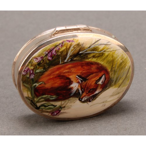 916 - A silver and enamel oval pill box, decorated with a curled up fox, 38mm wide, import marks for Hansf... 