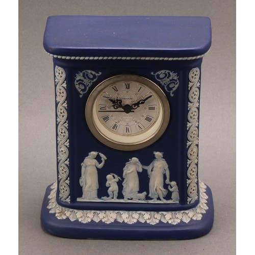 80 - A late Victorian Wedgwood Jasperware mantel clock, typically sprigged in white with classical scenes... 