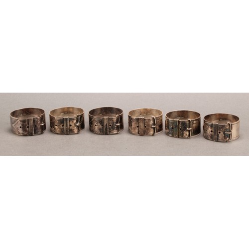 689 - A set of six Edwardian E.P.N.S novelty napkin rings, each as a buckled collar, 4.5cm diam, c.1905, c... 