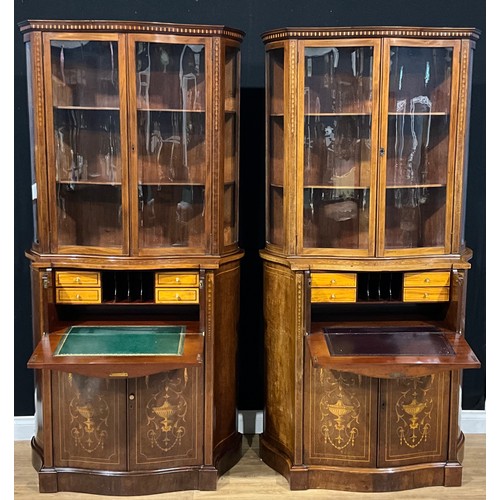 2412 - A pair of Sheraton Revival mahogany and marquetry serpentine secretaire display cabinets, each with ... 