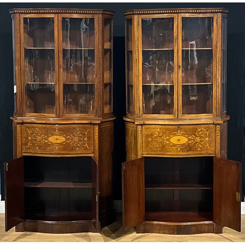 2412 - A pair of Sheraton Revival mahogany and marquetry serpentine secretaire display cabinets, each with ... 