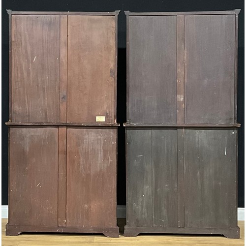 2412 - A pair of Sheraton Revival mahogany and marquetry serpentine secretaire display cabinets, each with ... 