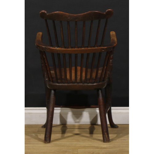 2405 - A 19th century vernacular beech, ash and elm Windsor comb back elbow chair, saddle seat, cabriole fo... 