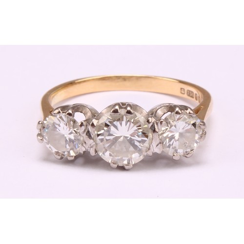 1203 - A diamond ring, central round brilliant cut diamond measuring 6.38 x 6.30 x 3.69mm, calculated diamo... 