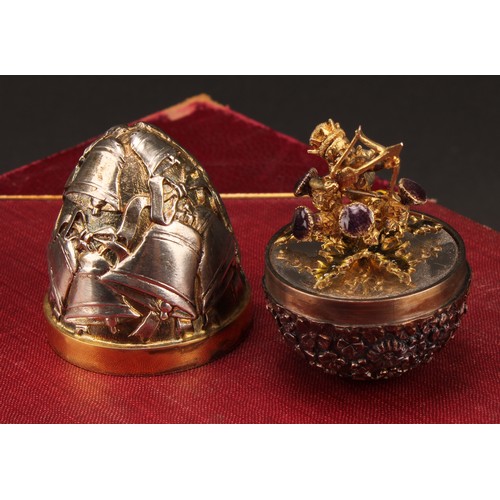 1132 - Stuart Devlin (1931-2018) - an Elizabeth II silver surprise egg, enclosing Cupid, numbered 34, 7cm h... 