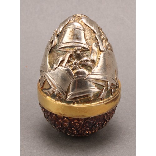 1132 - Stuart Devlin (1931-2018) - an Elizabeth II silver surprise egg, enclosing Cupid, numbered 34, 7cm h... 