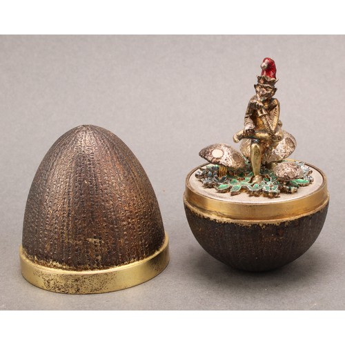 1130 - Stuart Devlin (1931-2018) - an Elizabeth II silver gilt surprise egg, enclosing a pixie on a toadsto... 