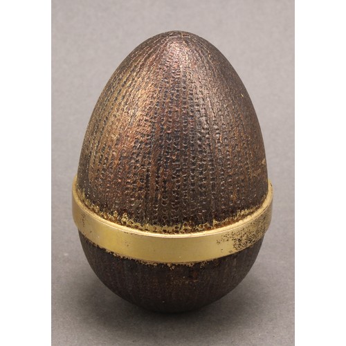 1130 - Stuart Devlin (1931-2018) - an Elizabeth II silver gilt surprise egg, enclosing a pixie on a toadsto... 