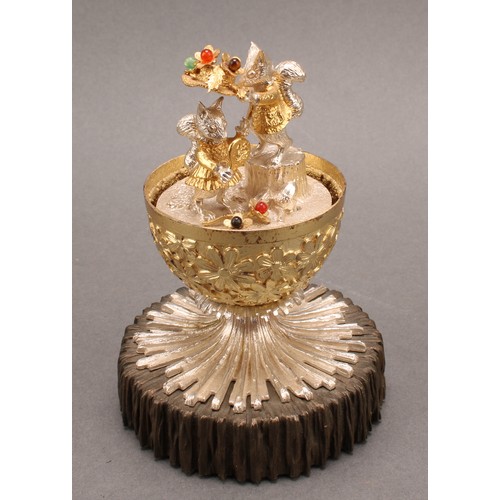 1079 - Christopher Nigel Lawrence (Bn.1936) - an Elizabeth II silver and silver-gilt musical surprise egg, ... 