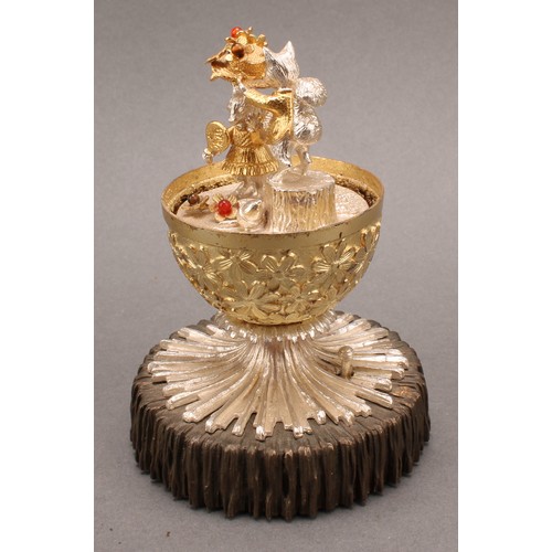 1079 - Christopher Nigel Lawrence (Bn.1936) - an Elizabeth II silver and silver-gilt musical surprise egg, ... 