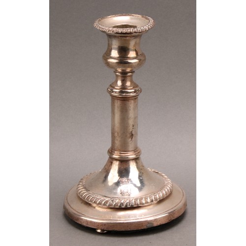 688 - A set of four silver plated candlesticks, campana sconces, removable nozzles, cylindrical pillars, s... 