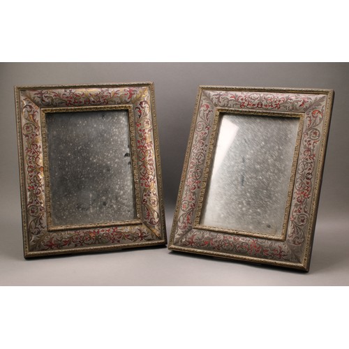 2570 - A pair of 19th century boulle rectangular country house easel mirrors, the cushion frame decorated w... 