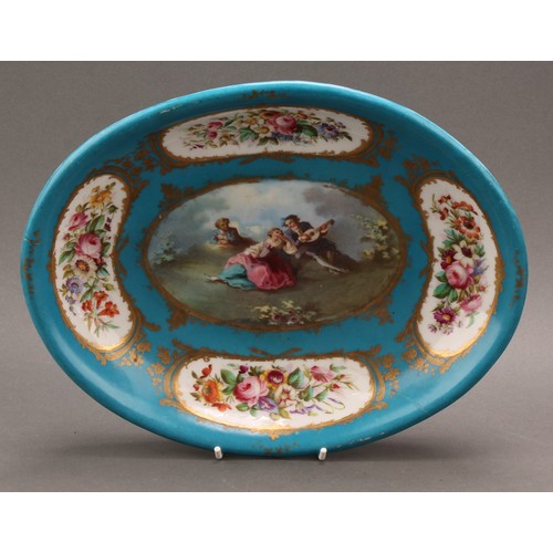 225 - A French oval dish, painted in the manner of Sèvres with a courting couple on a bleu celeste ground,... 