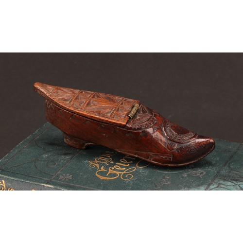 1412 - A 19th century chip-carved novelty snuff box, as a shoe, hinged cover, 11.5cm long