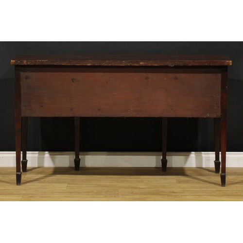 1504 - A George III mahogany bowfront sideboard or serving table, slightly oversailing top above three draw... 