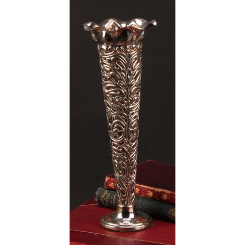 997 - An Art Nouveau silver trumpet shaped table centre vase, pierced and embossed with organic whiplash m... 