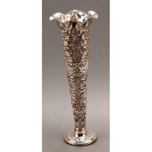 997 - An Art Nouveau silver trumpet shaped table centre vase, pierced and embossed with organic whiplash m... 