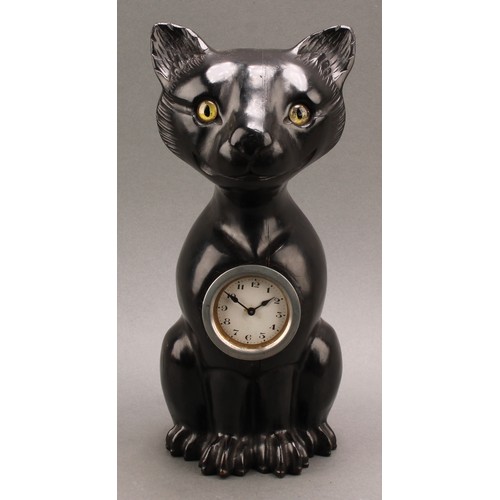 2340 - An early 20th century ebonised novelty timepiece, carved in the Black Forest manner as a seated cat ... 