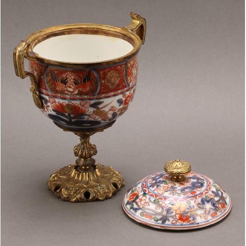 1312 - A pair of 18th century Chinese sucriers and covers, painted in the Imari palette and clobbered in gi... 