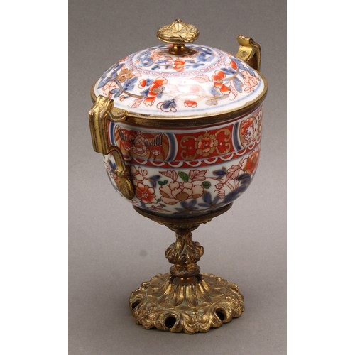 1312 - A pair of 18th century Chinese sucriers and covers, painted in the Imari palette and clobbered in gi... 