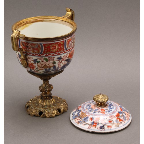 1312 - A pair of 18th century Chinese sucriers and covers, painted in the Imari palette and clobbered in gi... 