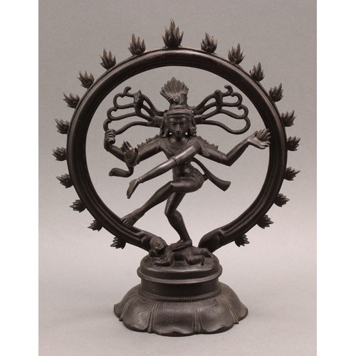 1372 - Indian School, a dark patinated bronze, Shiva Nataraja, lotus base, 31cm high