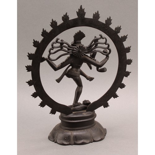 1372 - Indian School, a dark patinated bronze, Shiva Nataraja, lotus base, 31cm high