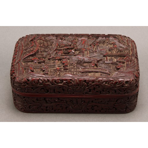 1279 - A Chinese cinnabar lacquer rounded rectangular box and cover, deeply carved with figures and pagodas... 