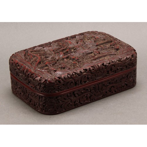 1279 - A Chinese cinnabar lacquer rounded rectangular box and cover, deeply carved with figures and pagodas... 