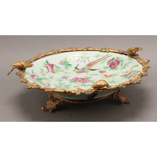 1293 - A 19th century gilt metal mounted Chinese dish, painted in the famille rose pallette in the Cantones... 