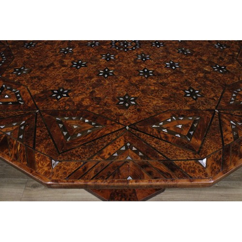 1507 - An Art Deco design burr yew, amboyna and mother of pearl parquetry dodecagonal centre table, the top... 