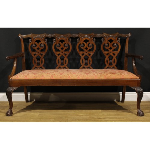 2408 - A Chippendale Revival mahogany quadruple-chair-back sofa, folded ribbon splats carved with eagle hea... 