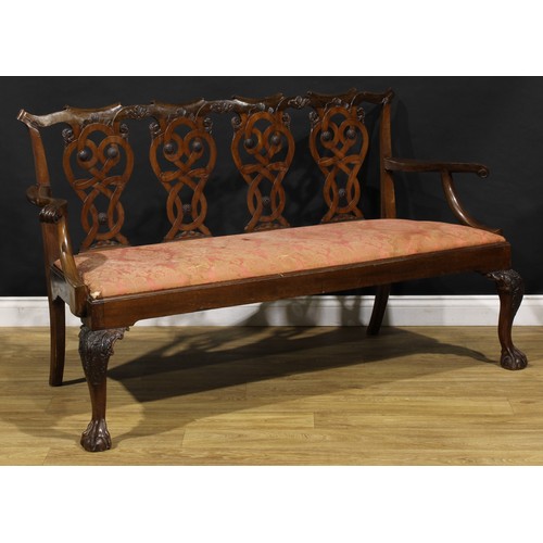 2408 - A Chippendale Revival mahogany quadruple-chair-back sofa, folded ribbon splats carved with eagle hea... 