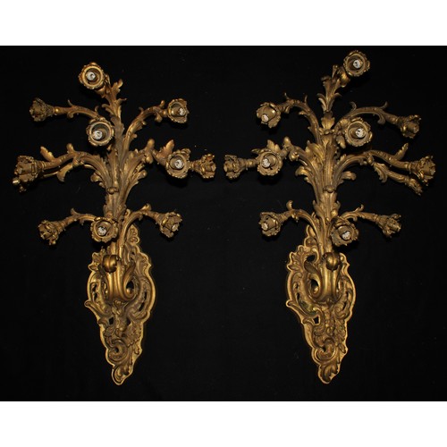 2480 - A pair of substantial Louis XV style gilt bronze eleven-light wall sconces, cast in the Rococo taste... 