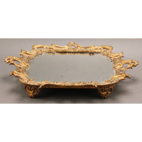 2326 - A French Rococo Revival gilt metal two handled liquor stand or tray, cast with rocaille, mirrored pl... 