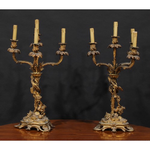 2477 - A pair of large 19th century gilt bronze four-light candelabra, acanthus campana sconces, each pilla... 