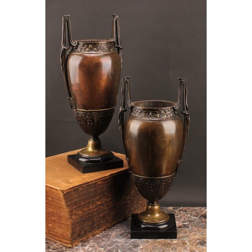 2085 - A pair of French Grecian Revival bronze-patinated ovoid mantel vases, each lofty handle cast with a ... 