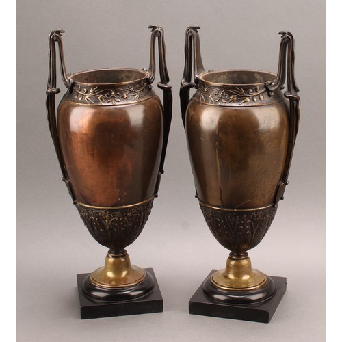 2085 - A pair of French Grecian Revival bronze-patinated ovoid mantel vases, each lofty handle cast with a ... 