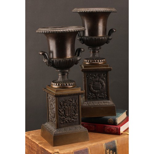 2081 - A pair of 19th century brown patinated bronze campana library urns, in the Grand Tour taste, each ba... 